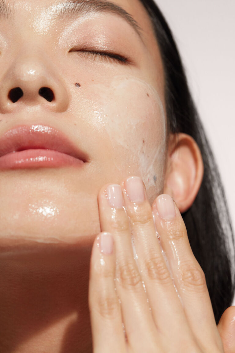 A close up of a woman with Mary Kay Timewise cleanser.