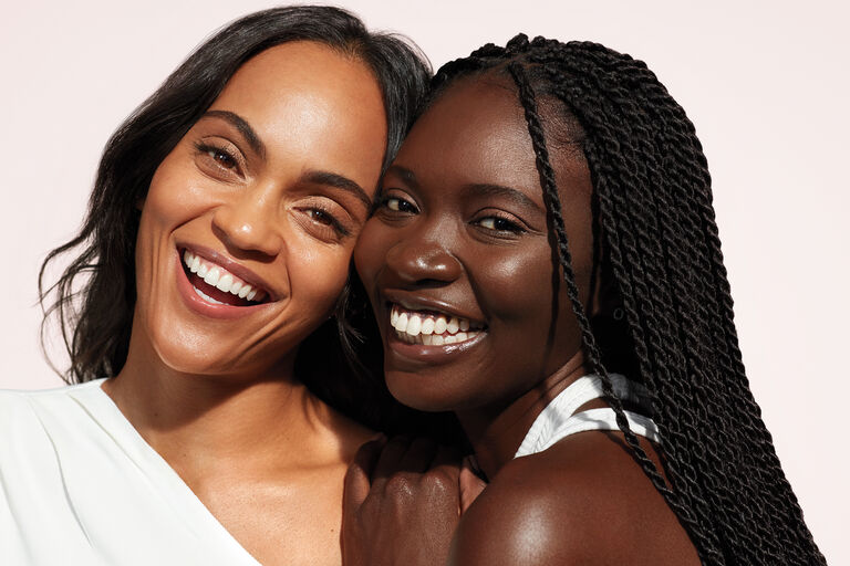 Two smiling women.