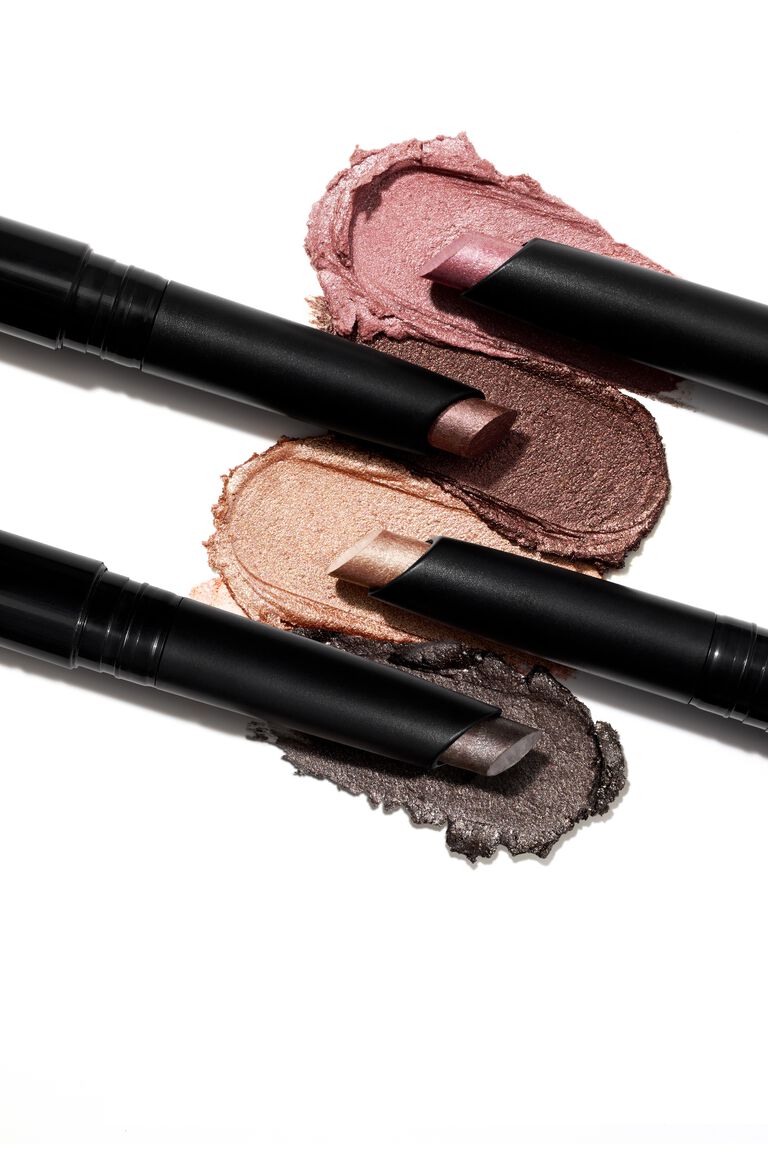 Group shot of 5 Mary Shimmer Eye Shadow Sticks with their texture rub alongside them