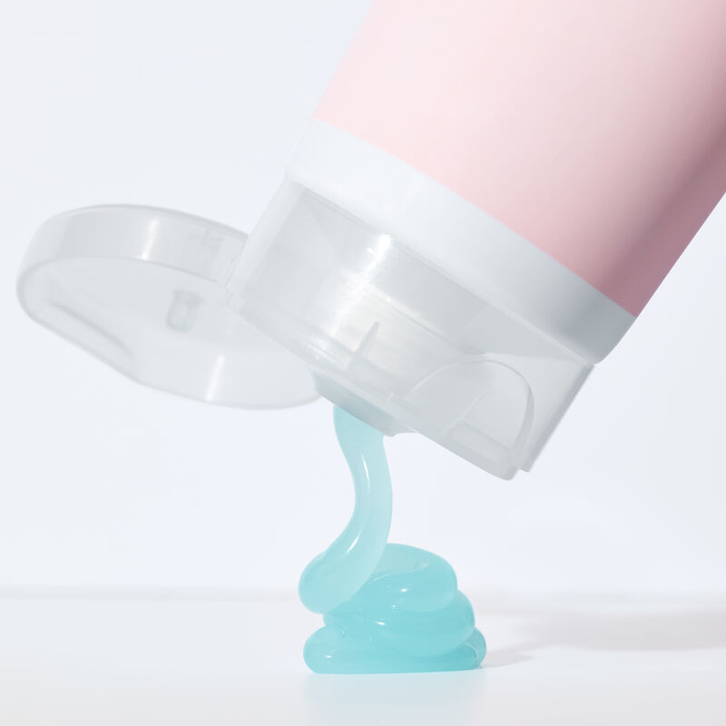 Blue gel product squeezing out of bottle of Mary Kay&reg; After-Sun Replenishing Gel image number null