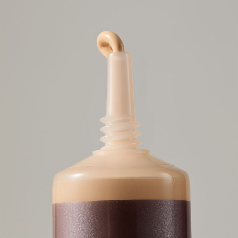 Macro view of TimeWise Matte 3D Foundation needle-nose applicator dispensing Light 5 shade