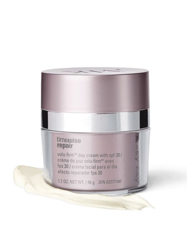 A jar of Mary Kay TimeWise Repair Volu-Firm Day Cream With SPF 30 styled on top of a product rub.&nbsp;