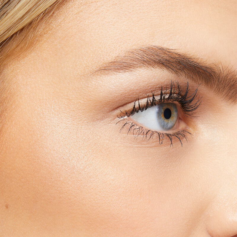 Close up of fair-skinned model with blonde hair and blue eyes wearing limited-edition Mary Kay Illuminating Bronzer&nbsp; image number null