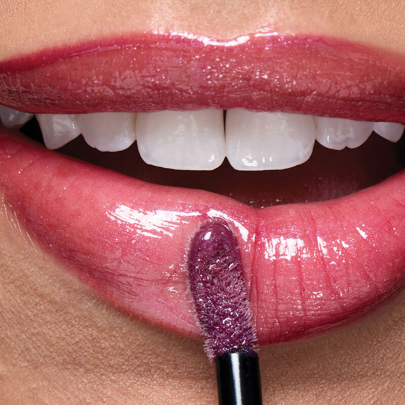 Macro of lips wearing Lilac Love with applicator.&nbsp; image number null