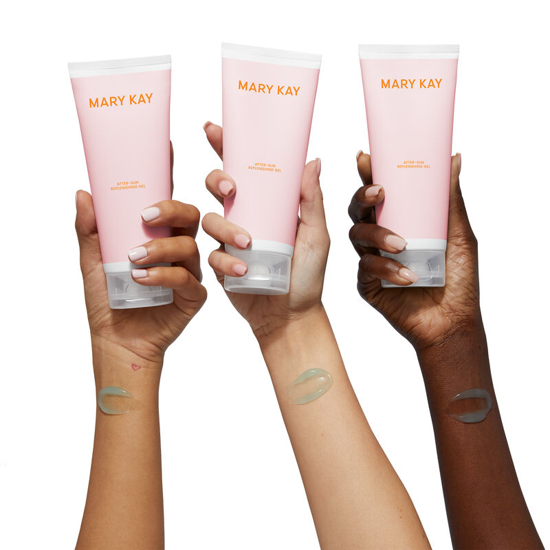 Medium, light, and deep skin tones arms, each with blue gel smear near wrist and holding up a bottle of Mary Kay&reg; After-Sun Replenishing Gel image number null