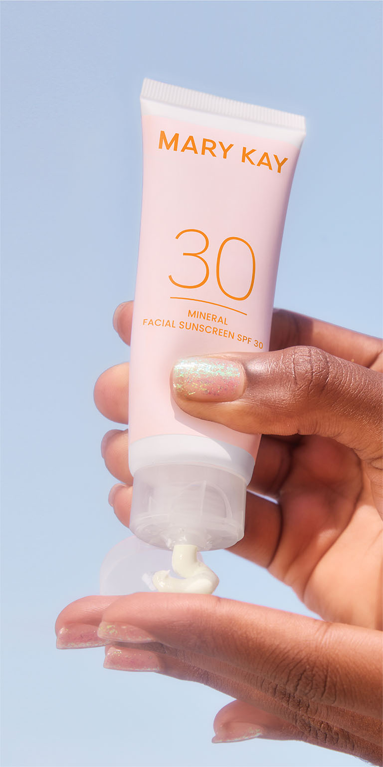 Model hand squeezing Mary Kay Mineral Facial Sunscreen Broad Spectrum SPF 30 on their hand