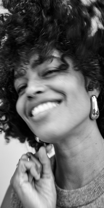 A close up of a woman with cleanser.