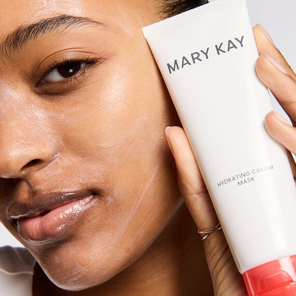 Woman applying thin layer of the Mary Kay Hydrating Cream Mask to her face