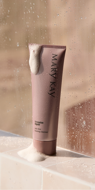 A close up of a woman's face with eye cream.