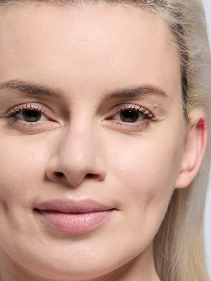 Light skin tone model shown after applying foundation.