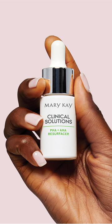 Model holding Mary Kay Clinical Solutions PHA + AHA Resurfacer
