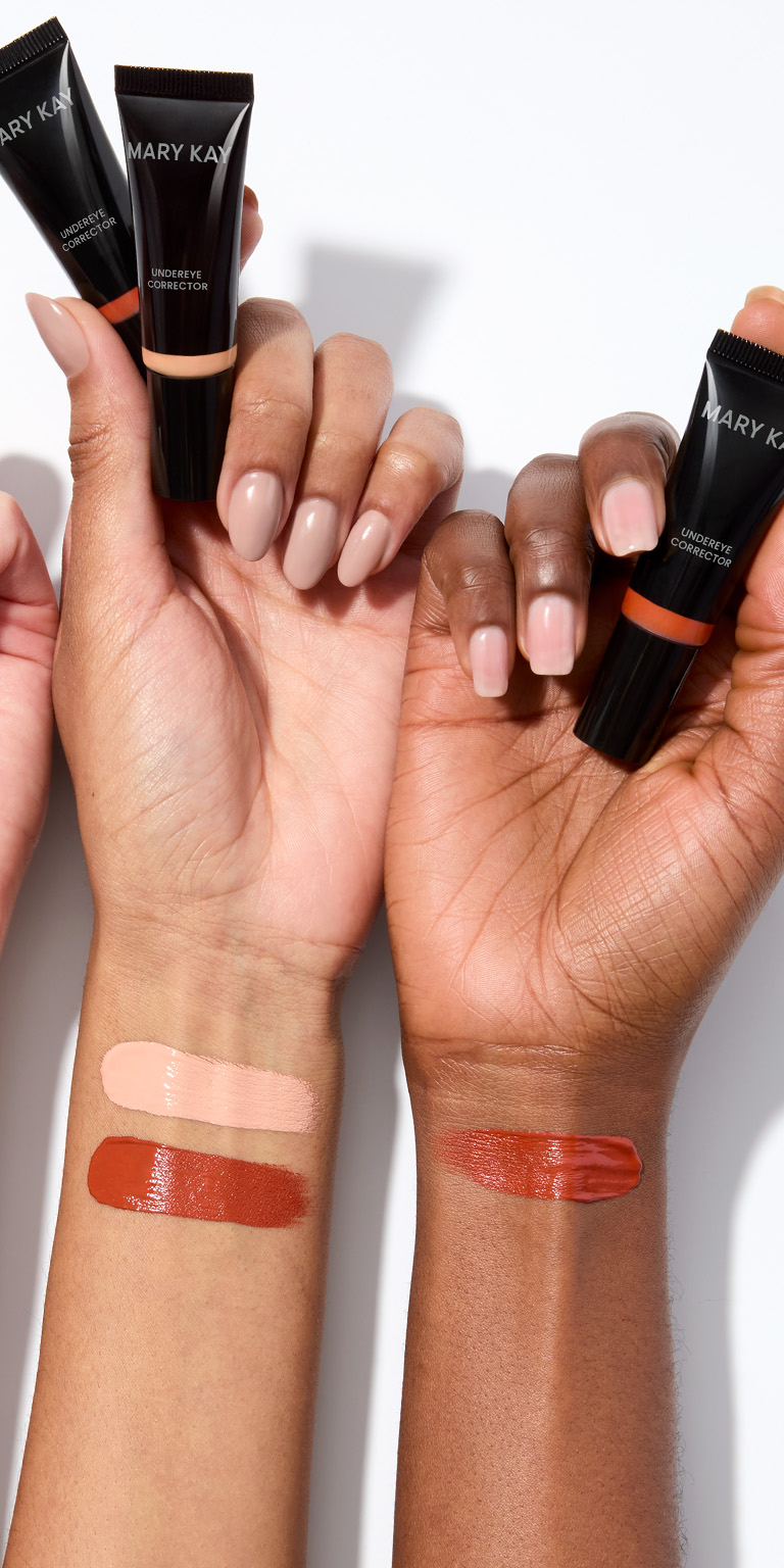 Product swatches of Mary Kay Undereye Corrector on fair and deep skin tones